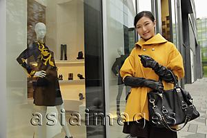 Asia Images Group - Young woman shopping outdoors
