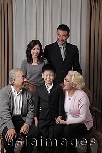 Asia Images Group - Three generation family dressed up laughing together