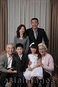 Asia Images Group - Three generation family posing for a photo together