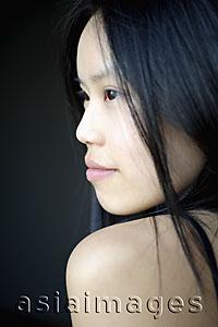 Asia Images Group - Head shot of young woman's profile