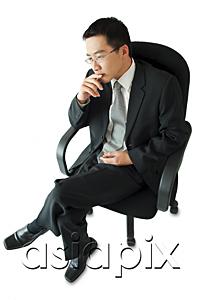 AsiaPix - Businessman sitting on office chair, hand on chin