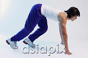 AsiaPix - Man bending at starting position, side view