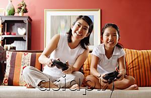 AsiaPix - Mother and daughter in living room, playing video game