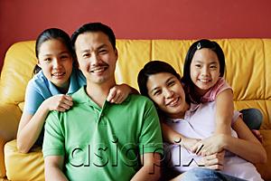 AsiaPix - Family of four smiling at camera, portrait