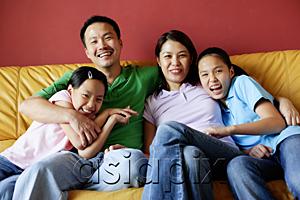AsiaPix - Family of four sitting on sofa, family portrait