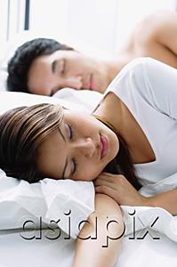 AsiaPix - Couple sleeping on bed