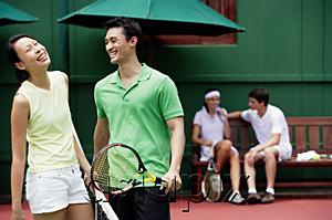 AsiaPix - Couples spending time together on tennis court, laughing