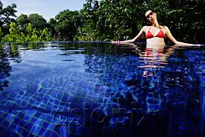 AsiaPix - Woman sitting in swimming pool
