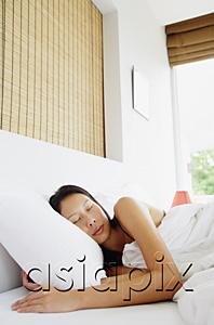 AsiaPix - Woman sleeping in bed