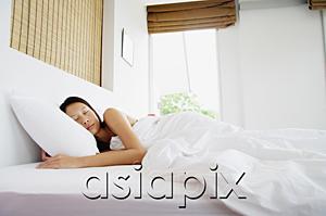AsiaPix - Woman in bedroom, sleeping