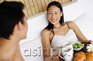 AsiaPix - Couple in bed having breakfast