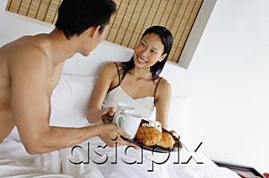 AsiaPix - Couple having breakfast in bed