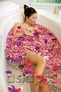 AsiaPix - Woman in bathtub, surrounded by flowers, looking at camera