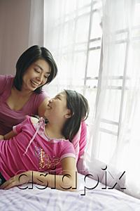 AsiaPix - Mother and daughter at home, looking at each other