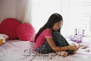 AsiaPix - Girl in bedroom, painting toenails, side view