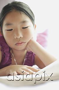AsiaPix - Girl reading book, hand on chin