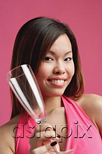 AsiaPix - Woman holding champagne glass