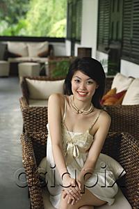 AsiaPix - Young woman in sleeveless dress smiling at camera