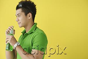 AsiaPix - Man drinking from water from bottle