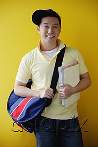 AsiaPix - Man with book bag and books