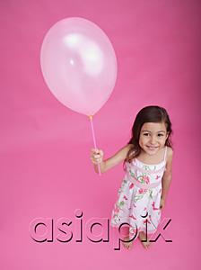 AsiaPix - Girl with balloon, smiling at camera