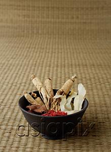 AsiaPix - Bowl filled with Chinese medicinal herbs, still life