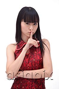 AsiaPix - Young woman, finger on mouth