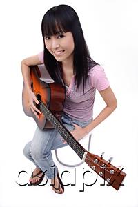 AsiaPix - Young woman with guitar, portrait