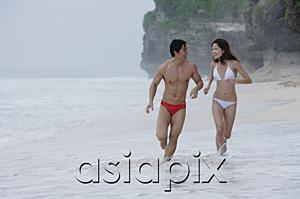 AsiaPix - Couple running along beach