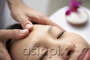 AsiaPix - Young woman receiving head massage