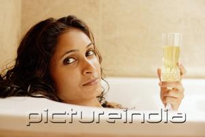 PictureIndia - Woman in bathtub, holding champagne glass