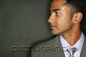 PictureIndia - Businessman looking away, side view
