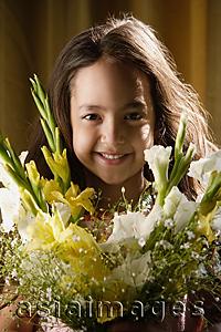 Asia Images Group - little girl smiling over bouquet of flowers