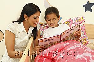 Asia Images Group - Mom reading story to daughter in bed