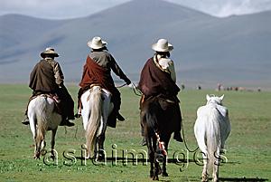 Asia Images Group - China, Szechuan (Sichuan), Kham region, Summer nomad festival, horsemen on grassland.