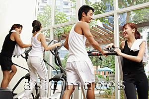 Asia Images Group - Couples in gym, walking on treadmill, in a row