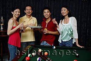 Asia Images Group - Couples eating appetizers, smiling at camera