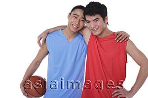 Asia Images Group - Two basketball players, with arms around each other, looking at camera