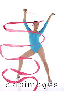Asia Images Group - Woman performing rhythmic gymnastics with ribbon