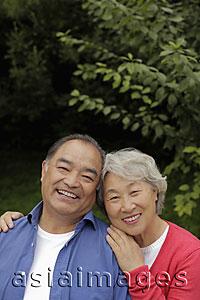 Asia Images Group - Head shot of older couple hugging outdoors