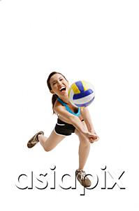 AsiaPix - Young woman hitting volleyball