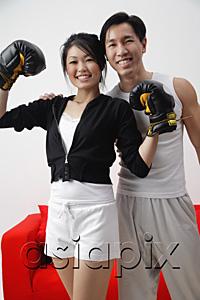 AsiaPix - Couple smiling at camera, woman with boxing gloves